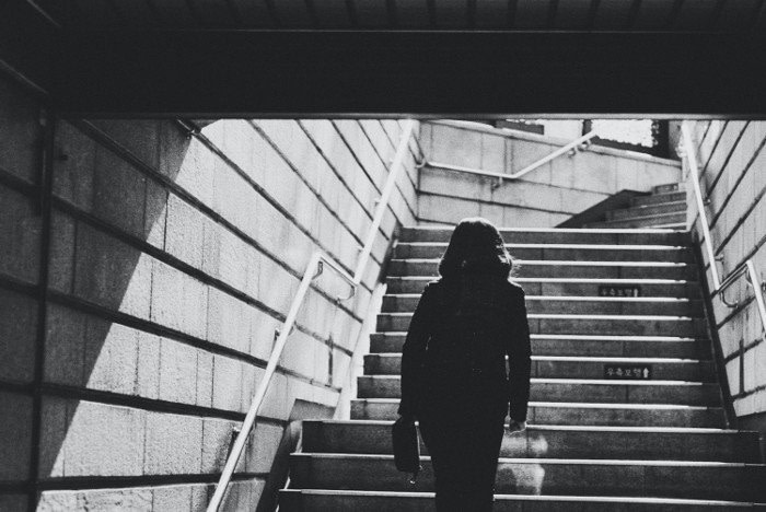 woman walking up stairs for better health